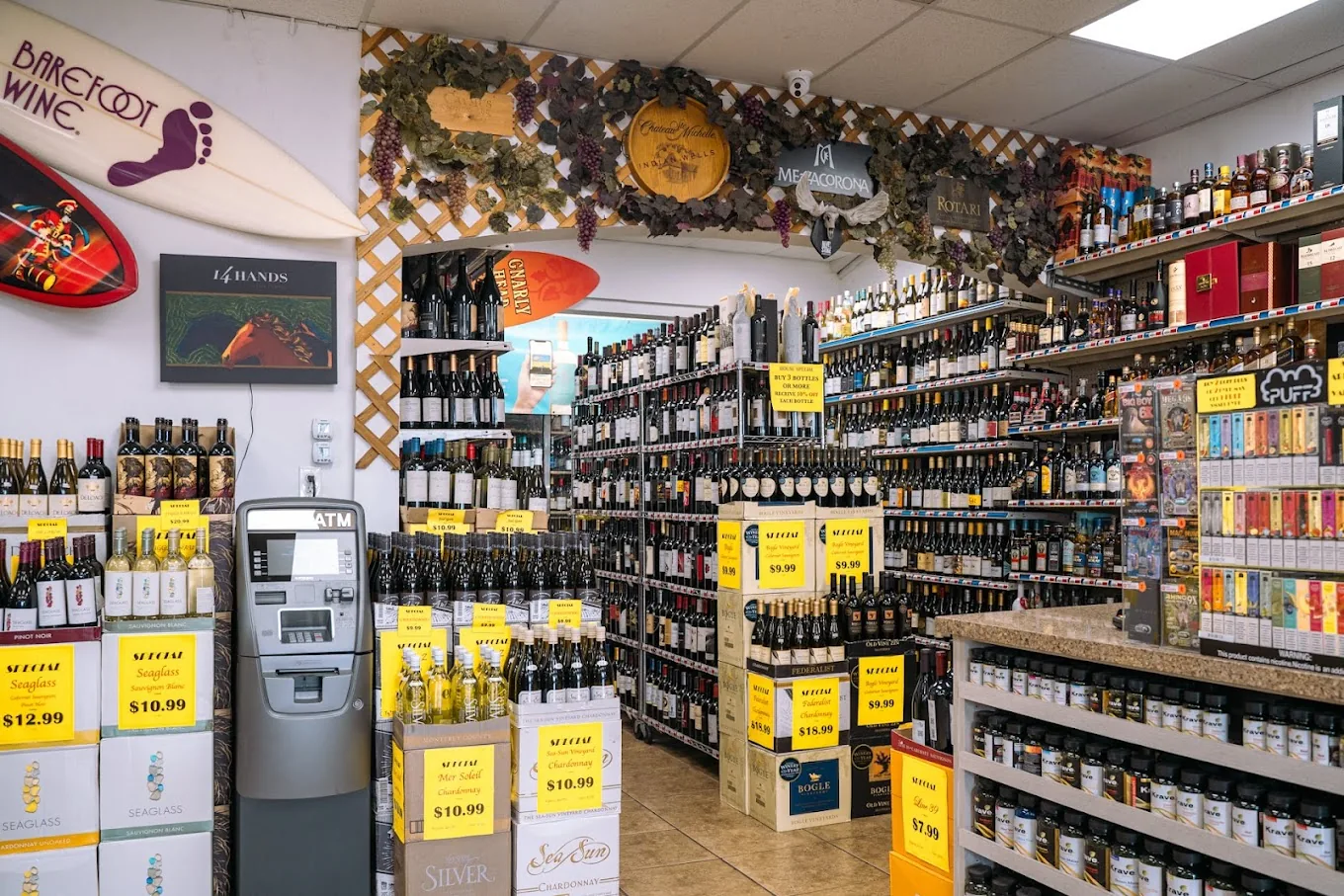 Wine aisle with in-store ATM, specials, and Barefoot wine
