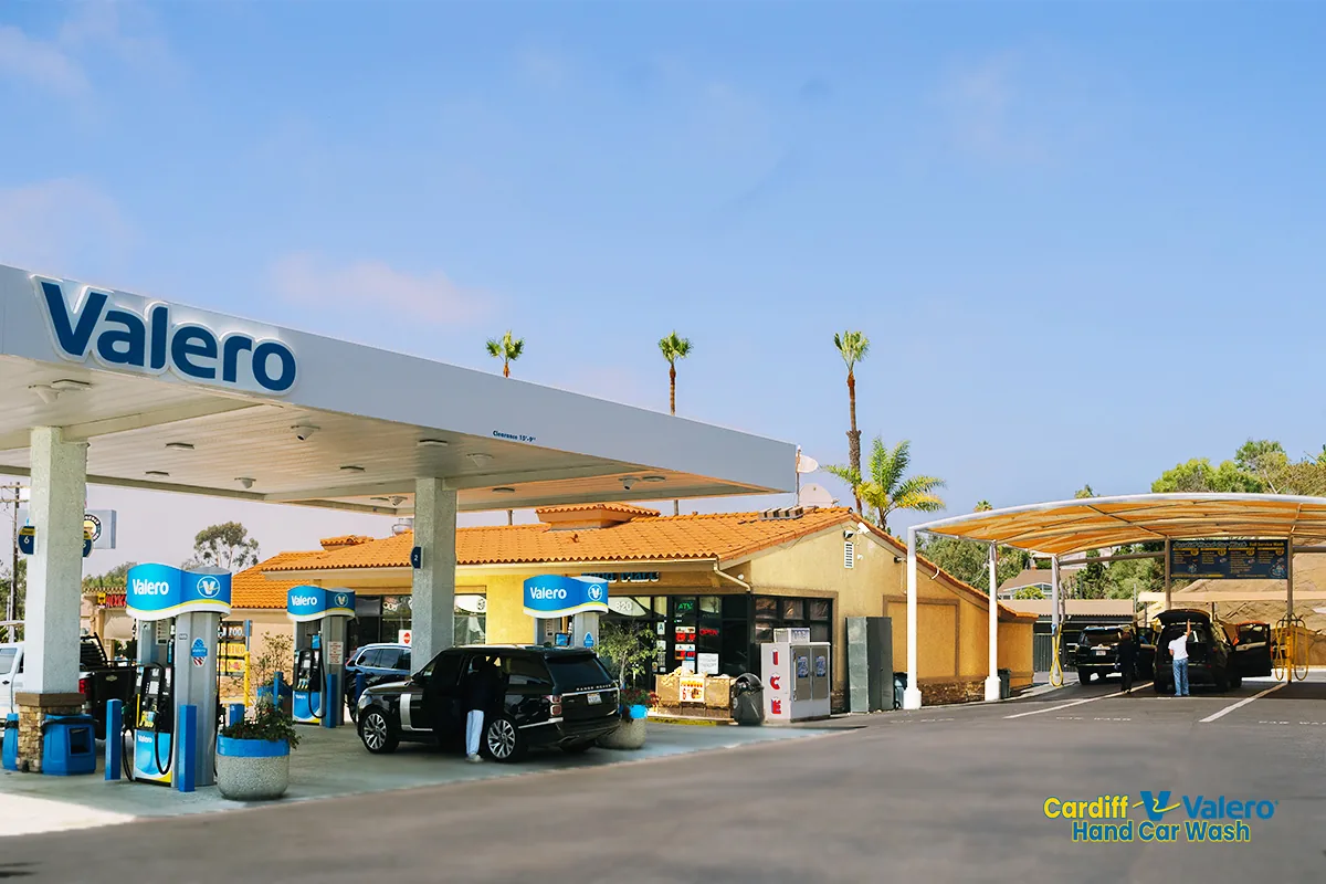 Wide view of Cardiff Valero lot — pumps, store, and car wash